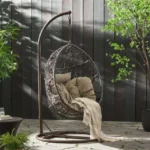 All Weather Wicker Single Seater Swing Chair in dark brown and grey, with sturdy frame and cushioned seat, perfect for outdoor relaxation.