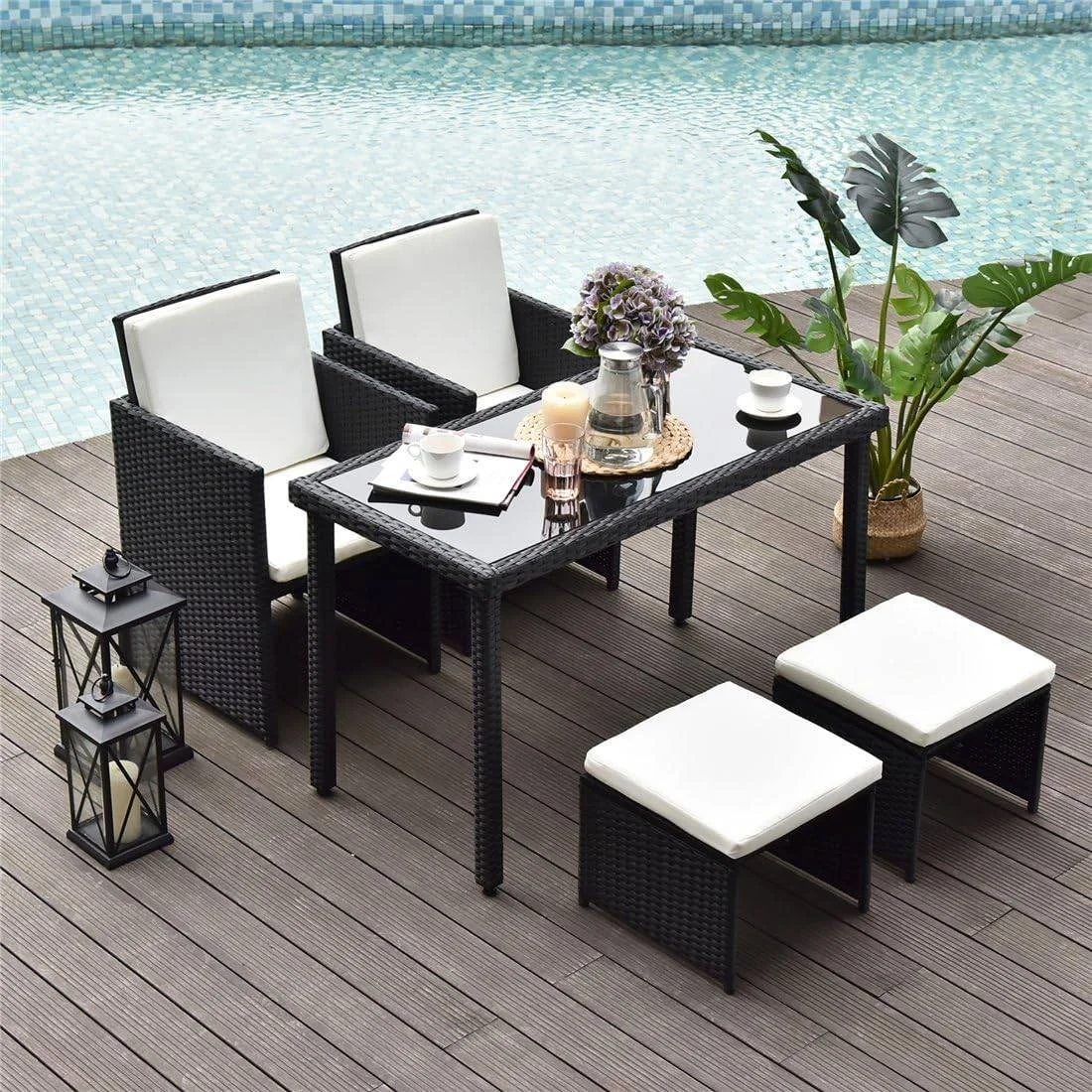 5-piece outdoor rattan wicker furniture set in black and white with chairs, sofa, and table