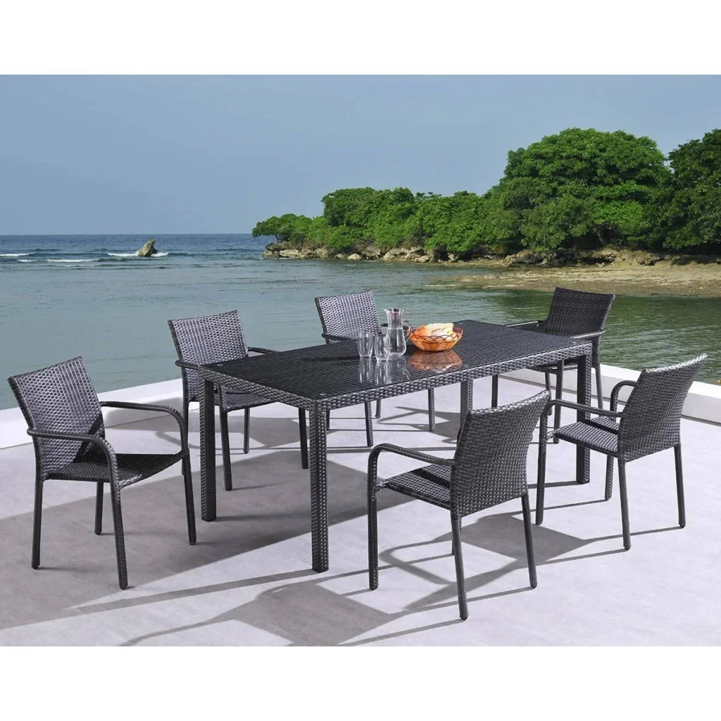 Black 7-piece wicker patio dining set with six chairs and a rectangular table on a patio.