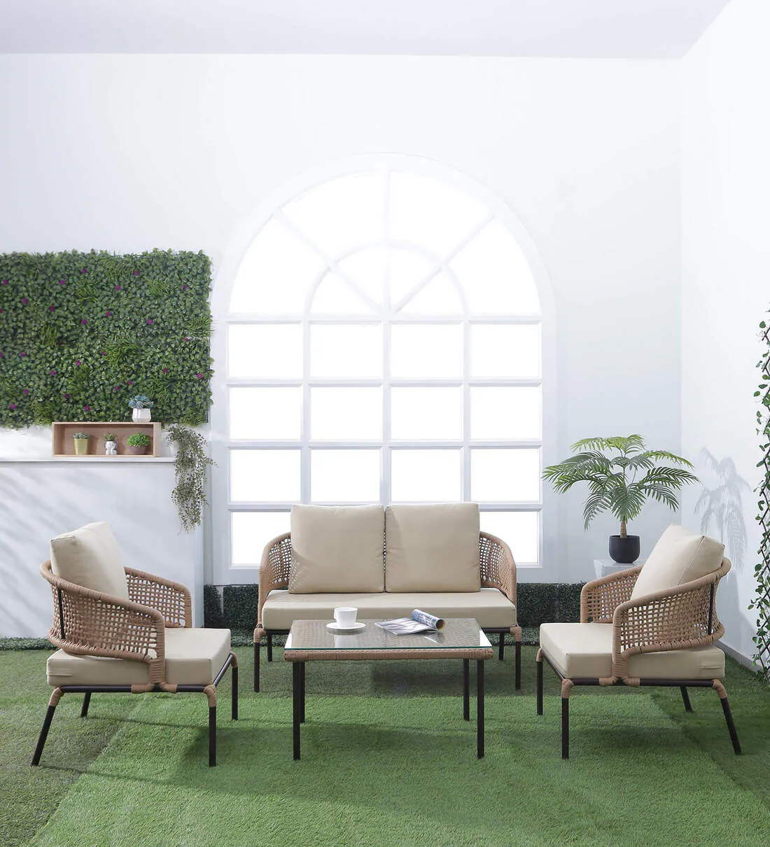 Beige and cream all-weather patio rope sofa set with glass top coffee table on outdoor deck