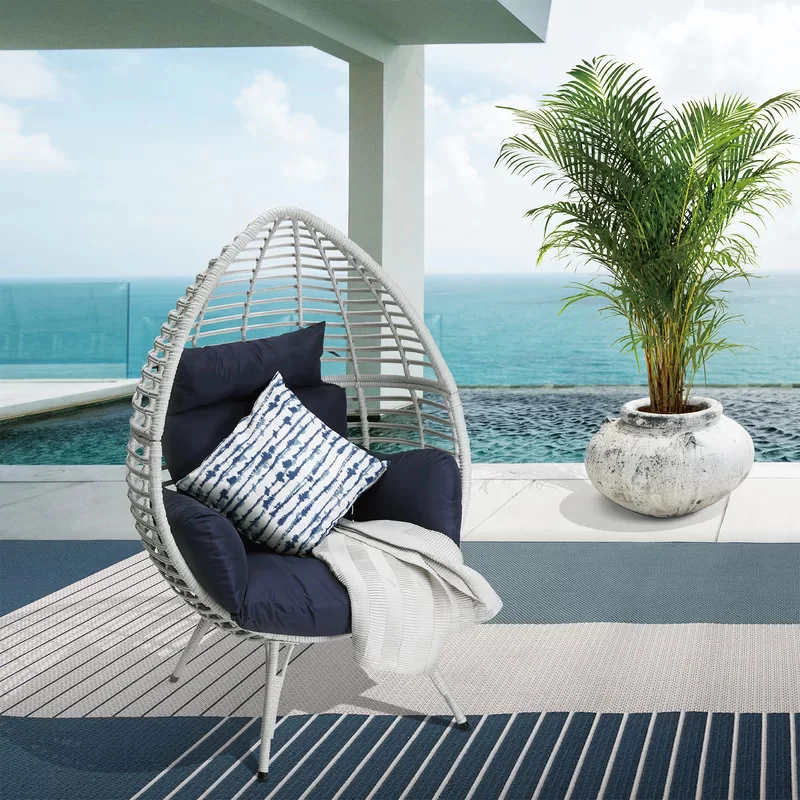 White single seater swing basket with cushioned seat, perfect for balcony or garden use.