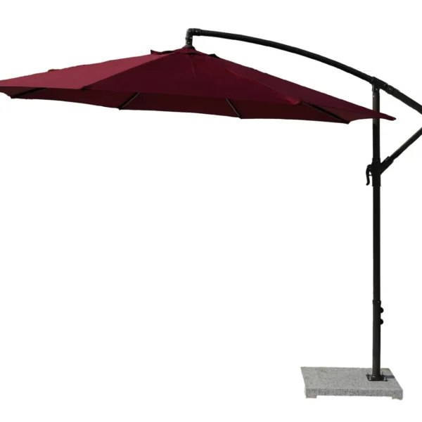 9-foot red offset cantilever patio umbrella with marble base and crank handle in a backyard setting