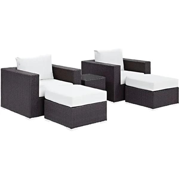 Dark brown and white outdoor rattan sofa set with matching ottoman and table, perfect for patio or garden seating.