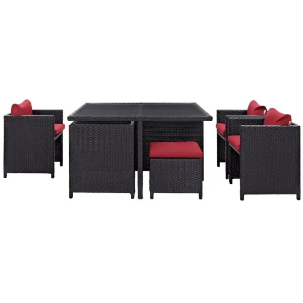 7 piece dark brown wicker outdoor dining set with red cushions, ottoman, and table without glass top.”