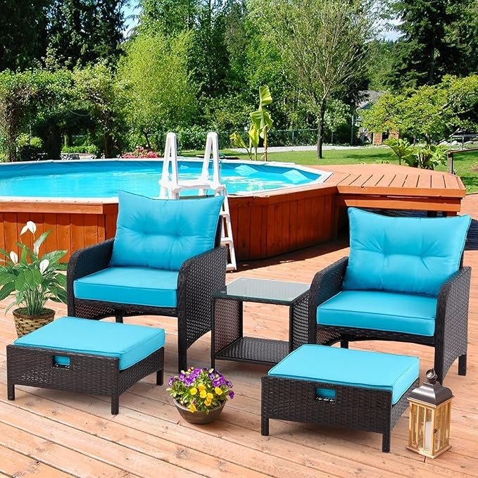 patio furniture set with brown wicker frame and sky-blue cushions, including chairs, table, and ottoman for outdoor use.