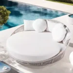Outdoor round daybed with woven rope design in beige, perfect for relaxing in the garden or patio.