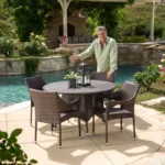4-person round outdoor dining set with comfortable cushioned seats in garden/patio setting