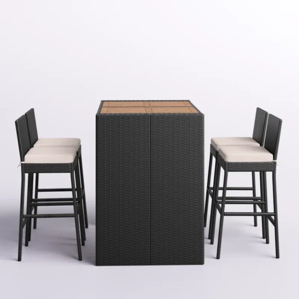 5 piece outdoor patio rattan bar set in black and white with high chairs and a bar table arranged on a garden patio.
