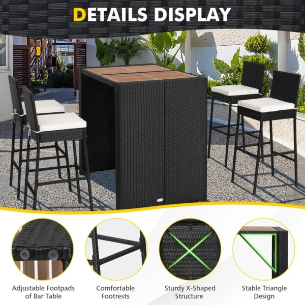 5 piece outdoor patio rattan bar set in black and white with high chairs and a bar table arranged on a garden patio.