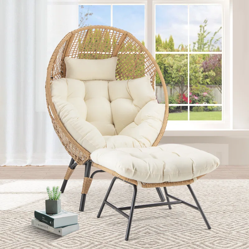 Beige single seater swing basket with ottoman for balcony and garden relaxation