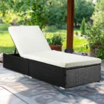 Outdoor rattan wicker sun lounger recliner chair in black and off-white, perfect for garden relaxation.