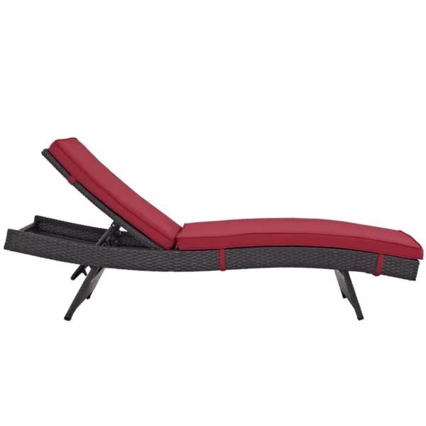 Add a pop of color and comfort to your patio with this stylish dark red wicker chaise lounge chair.
