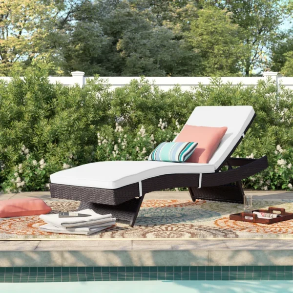 Off-white wicker rattan outdoor patio chaise lounge chair with cushioned seating.