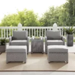 5-piece silver and grey patio furniture set with chairs, table, and cushions on a garden patio