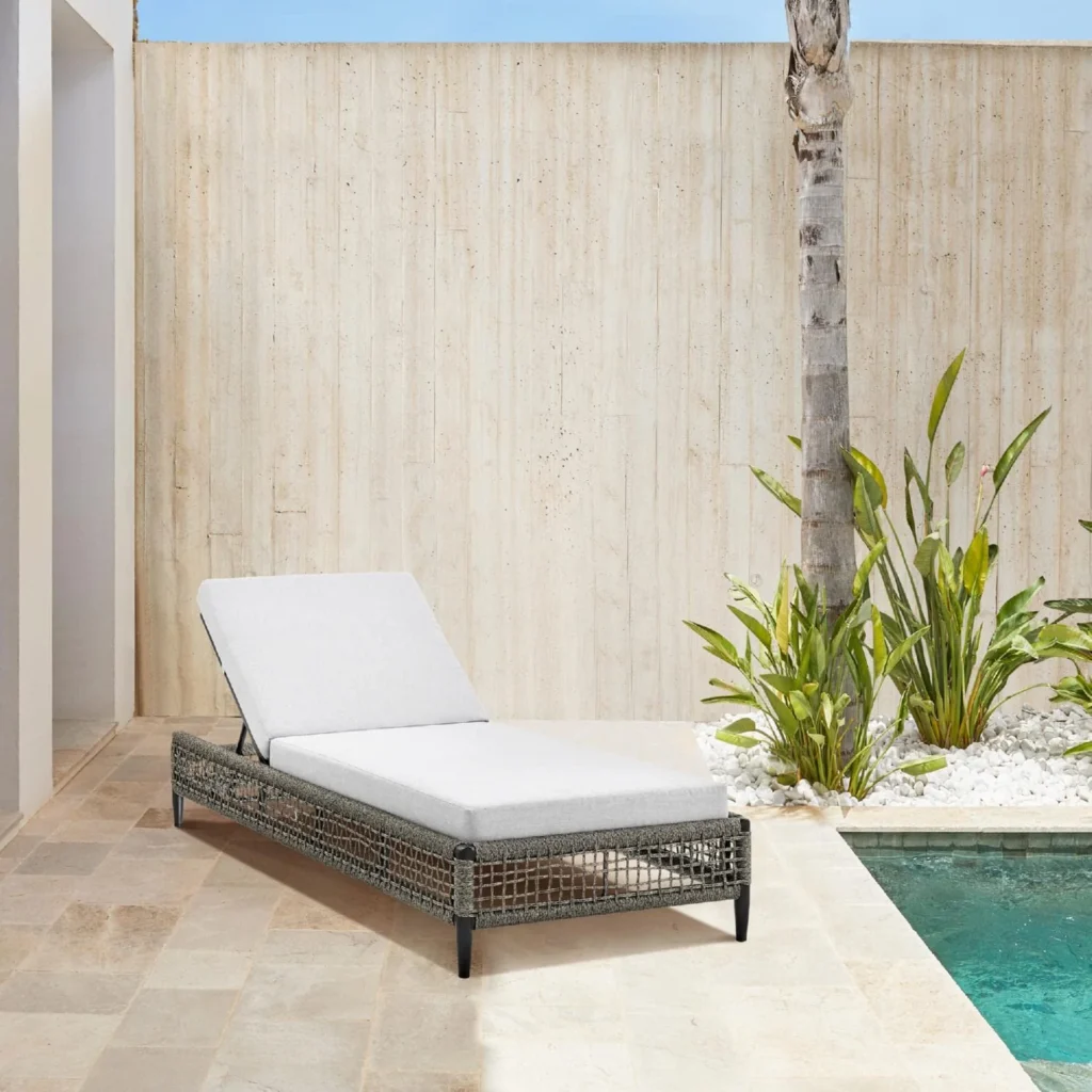 Grey rope sun lounger with matching grey cushion for outdoor use.