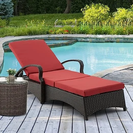 Red wicker rattan outdoor patio chaise lounge chair with side table, perfect for relaxing outdoors.