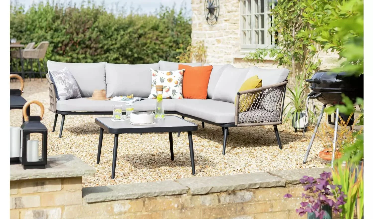 Modern L-shaped outdoor sofa set with plush cushions and sleek design, perfect for patio or garden seating