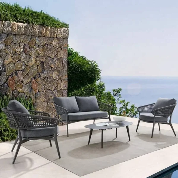 Outdoor grey rope 4-seater bistro set with a table and chairs on a patio