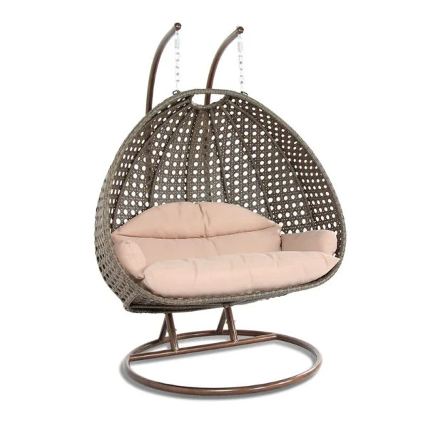 Double seater hanging swing chair with dark brown wicker frame and cream cushions