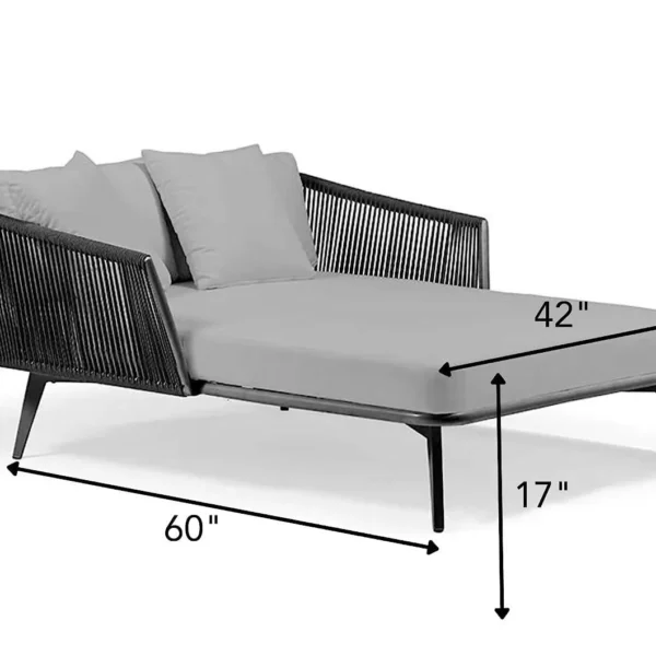 Black and grey patio rope daybed set with cushions placed outdoors on a wooden deck surrounded by greenery.