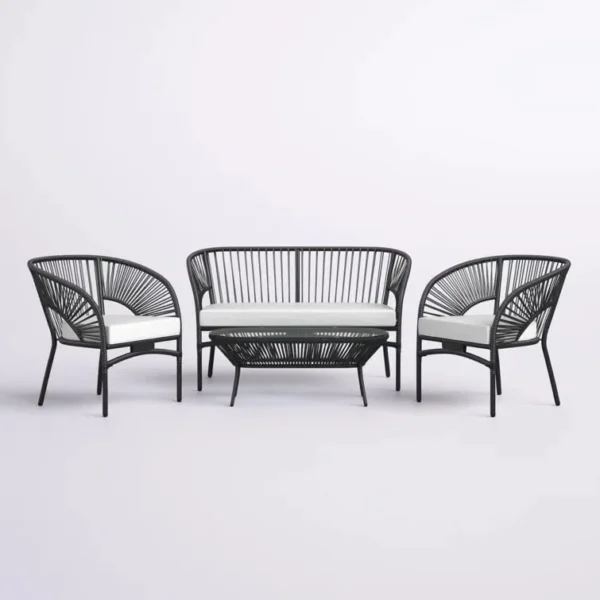 4-seater outdoor rope sofa set in black and white with a matching center table placed on a patio.