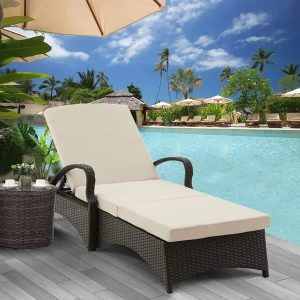 Wicker rattan outdoor patio chaise lounge chair with side table in cream color, perfect for relaxing outdoors.