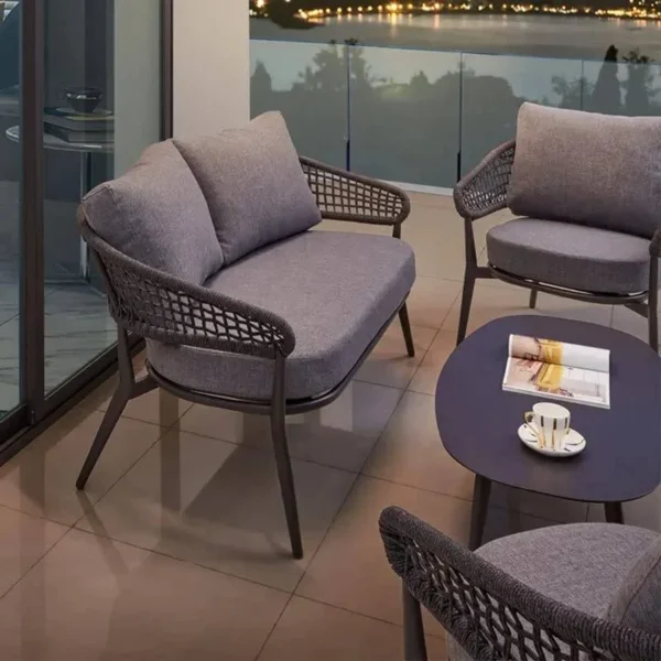 Outdoor grey rope 4-seater bistro set with a table and chairs on a patio