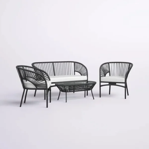 4-seater outdoor rope sofa set in black and white with a matching center table placed on a patio.