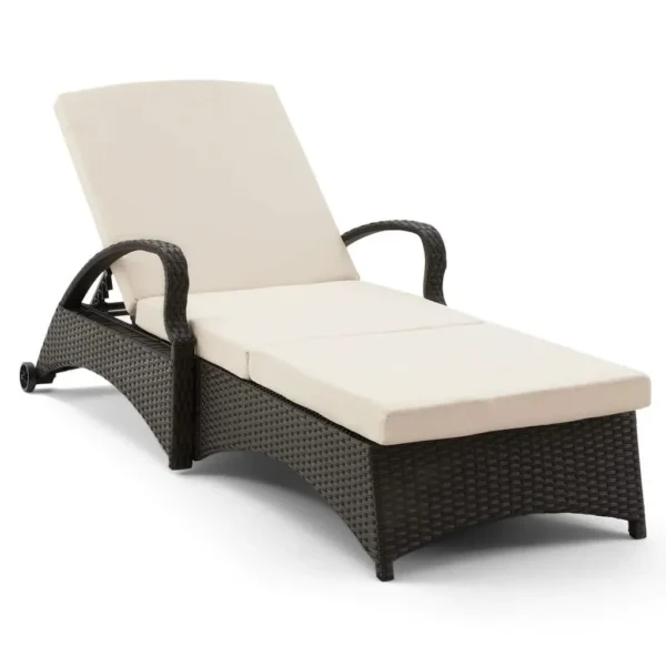 Wicker rattan outdoor patio chaise lounge chair with side table in cream color, perfect for relaxing outdoors.
