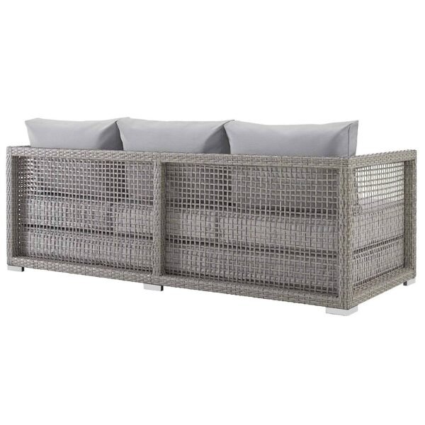 Outdoor 6-piece rattan wicker sectional sofa set in silver and grey, placed in a garden setting with cushions.