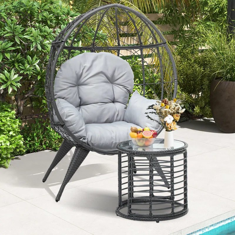 Single seater swing basket in black and grey, ideal for balcony and garden relaxation.