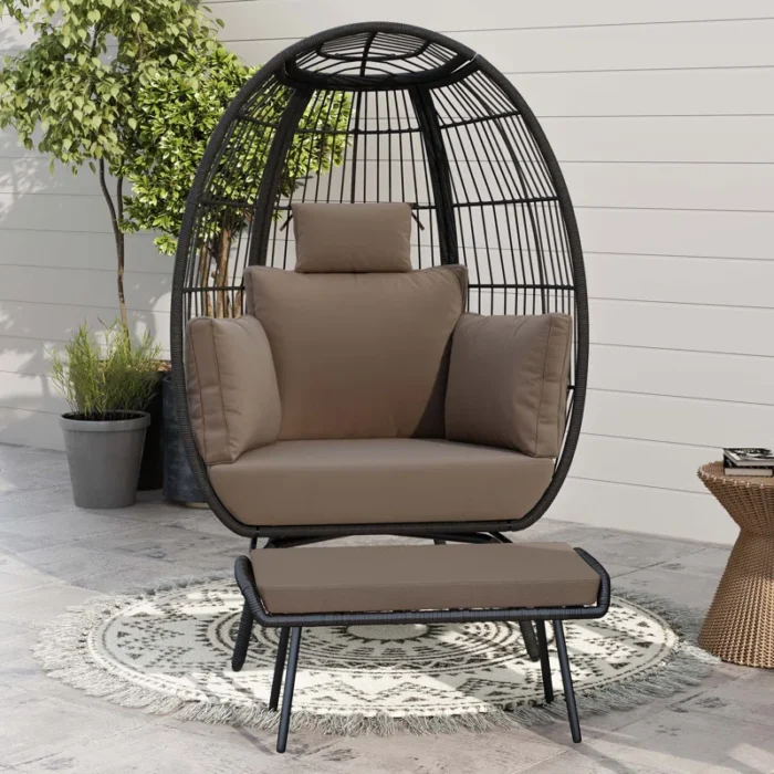 Black double -seater swing basket with ottoman, perfect for balcony and garden seating.