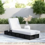 black rope sun lounger with soft white cushion for outdoor use.