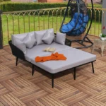Outdoor patio daybed with black woven nylon rope backrest and light grey washable cushion