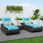 Dark brown rattan outdoor reclining chaise lounge with sky blue cushions.