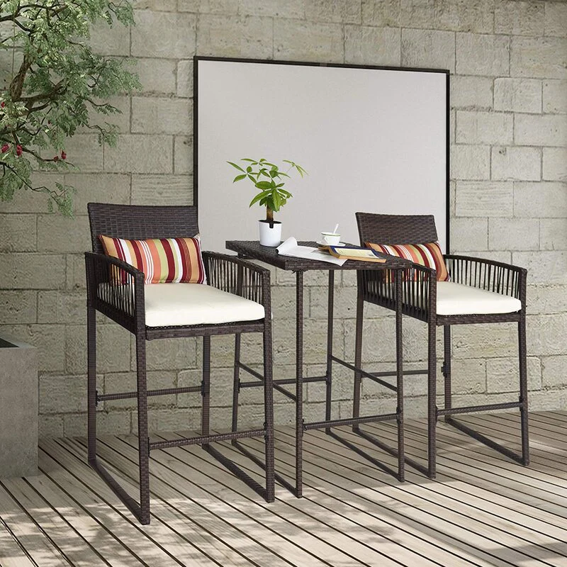 Outdoor patio bar set with two brown chairs and matching table, ideal for garden or terrace.
