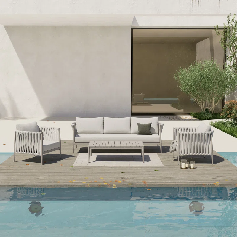 Outdoor 4-piece grey rope sofa set with cushions, perfect for patios and gardens