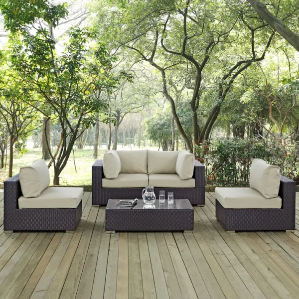 "4 pcs waterproof patio wicker furniture set with cushioned seats and glass-top table for outdoor spaces