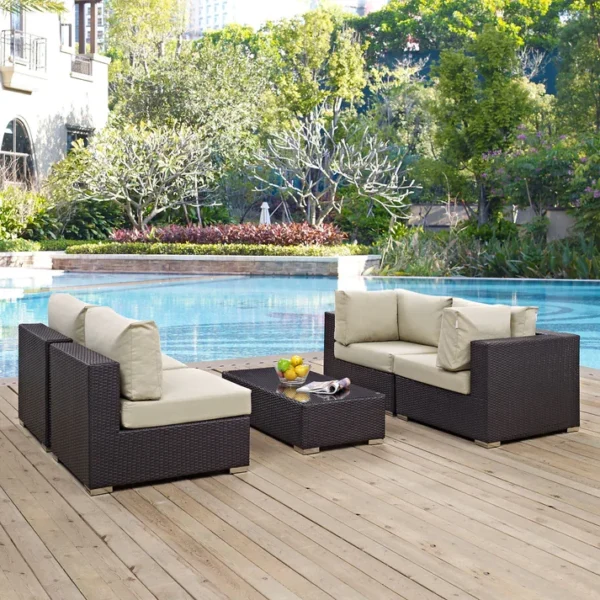 "4 pcs waterproof patio wicker furniture set with cushioned seats and glass-top table for outdoor spaces