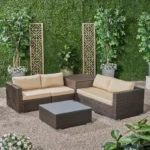 4-piece outdoor wicker patio sofa set with cushioned seating, glass coffee table, and side table for garden or backyard relaxation"