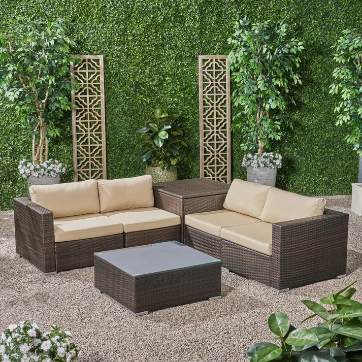4-piece outdoor wicker patio sofa set with cushioned seating, glass coffee table, and side table for garden or backyard relaxation"