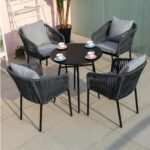 “Outdoor patio set with 4 chairs and 1 table, featuring braided rope design.”