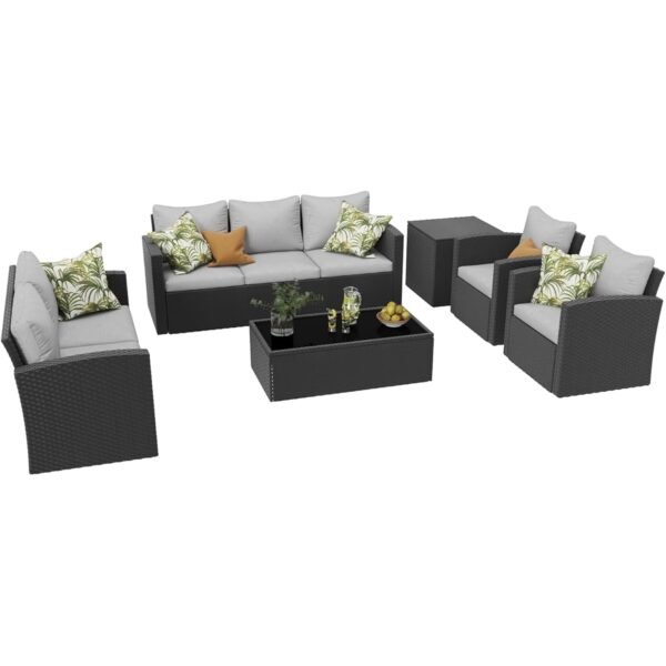 Outdoor rattan wicker patio sofa set with beige cushions and matching center table in garden setting