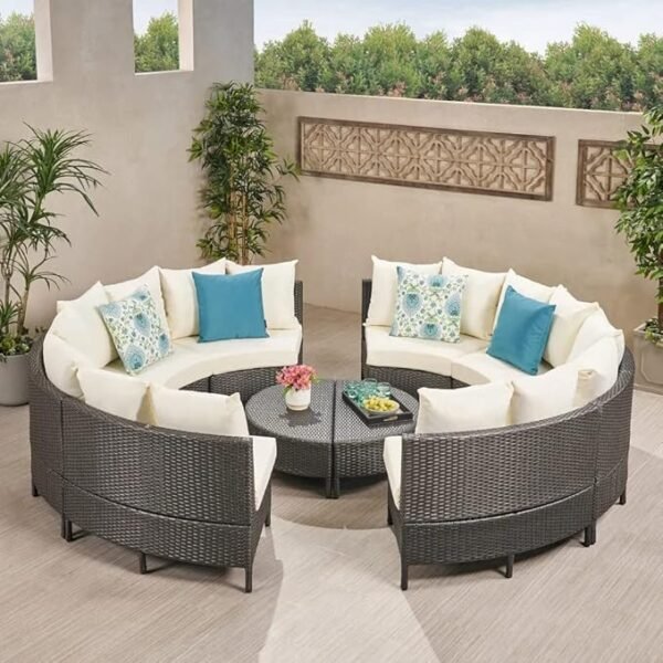 Outdoor rattan wicker full moon sofa set with cushions on a garden patio