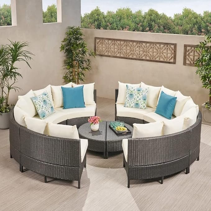 Outdoor rattan wicker full moon sofa set with cushions on a garden patio
