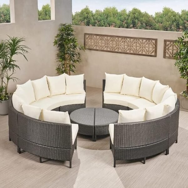 Outdoor rattan wicker full moon sofa set with cushions on a garden patio