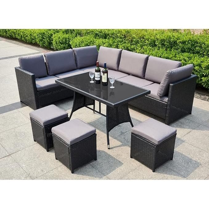 Modern outdoor rattan wicker patio set with cushioned chairs, glass-top coffee table, and weatherproof design for garden or balcony.
