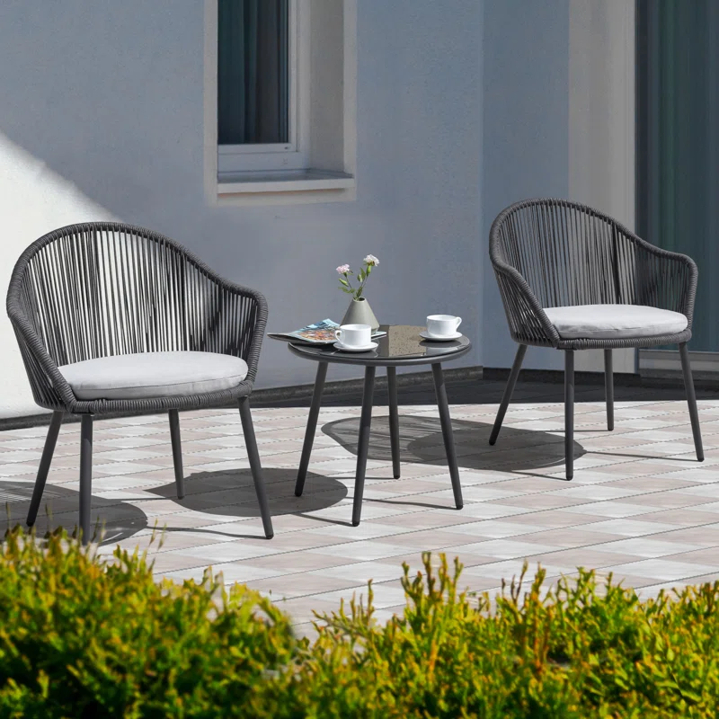 3-piece outdoor patio bistro set with rope detailing and comfortable cushions, featuring two chairs and a round table