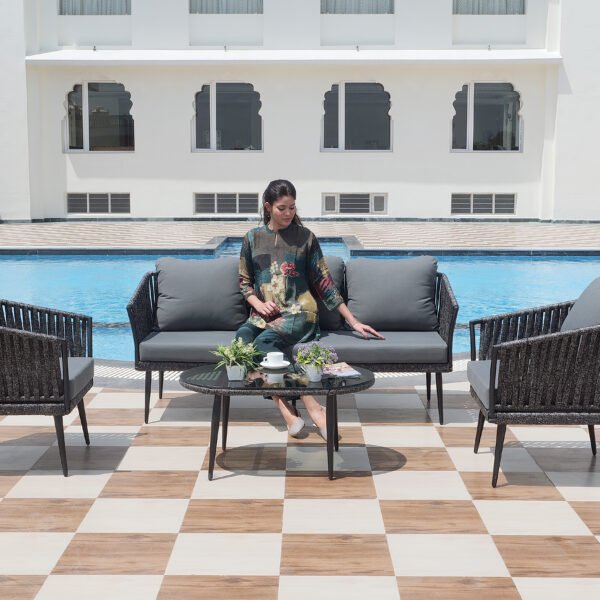 Outdoor 4-piece grey rope sofa set with centre table on patio