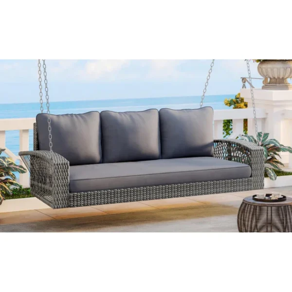Outdoor 3-person porch swing made of durable HDPE wicker with comfortable cushions